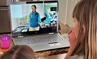 Children watching Educator on laptop